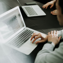 Photo of a man sitting at a laptop